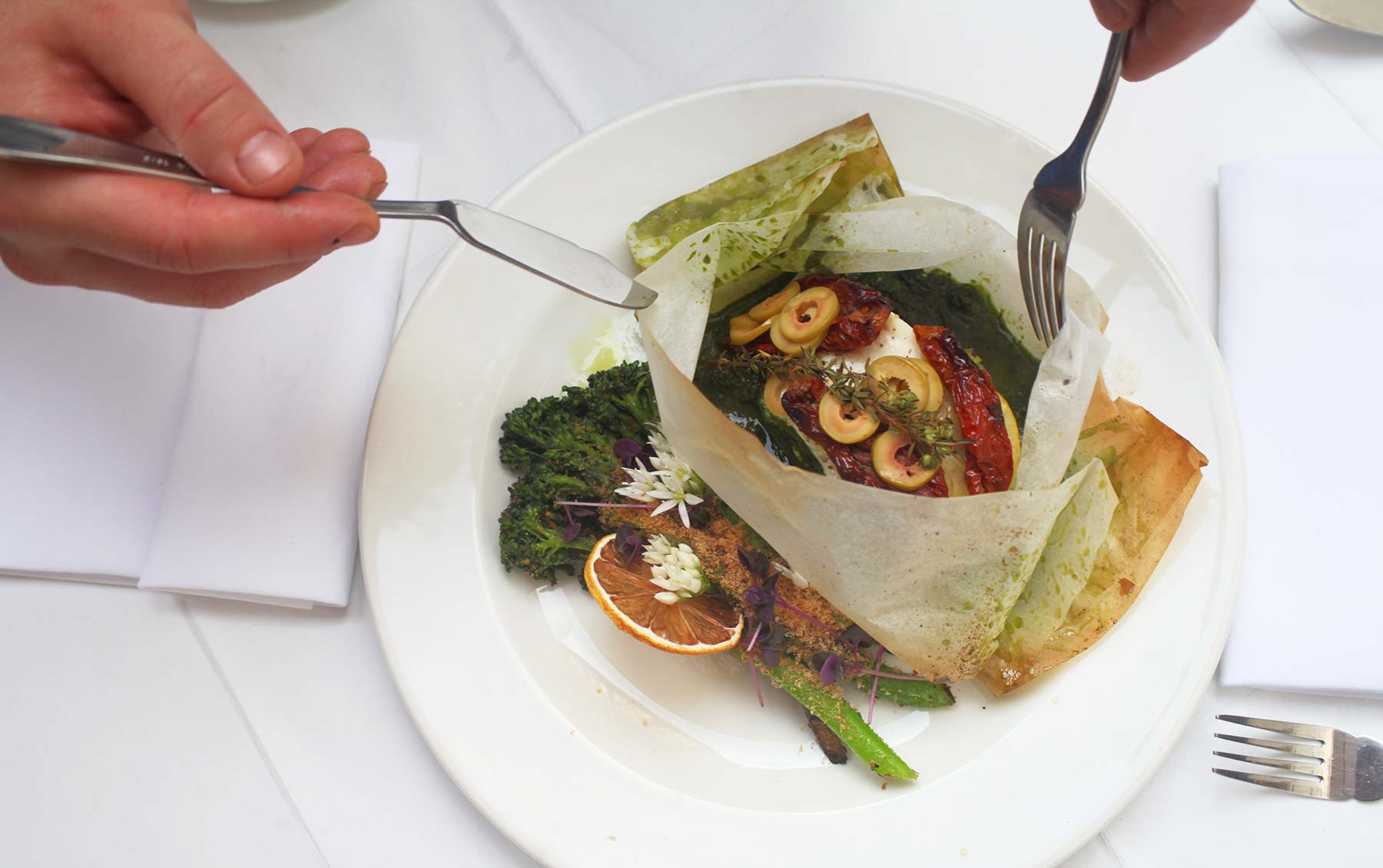 Monkfish ‘en papillote’, preserved tomato, green olives, wild garlic, sprouting broccoli, smoked cod roe, dried lemon.